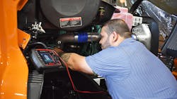 A technician from A. Duie Pyle performs diagnostics on a truck. A technician from A. Duie Pyle performs diagnostics on a truck.