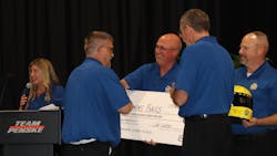 Penske technician Tommy Bass is congratulated after winning the company's 2023 Tech Showdown. Penske technician Tommy Bass is congratulated after winning the company's 2023 Tech Showdown.