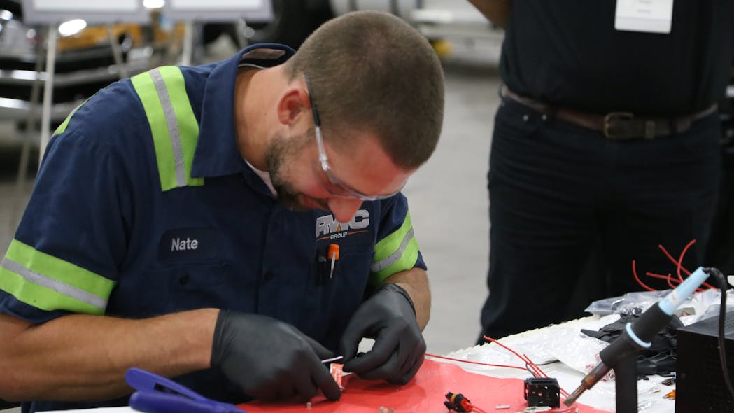 Reed competes at Navistar&apos;s Top Team technician skills competition.
