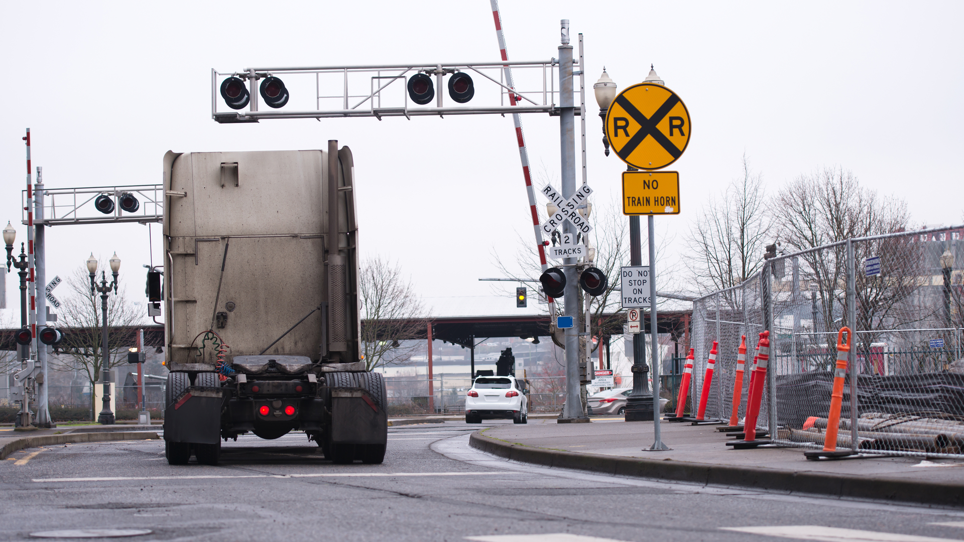 Truck at railroad stop