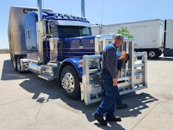 Graber and one of his technicians check out a livestock carrier in need of a filter change. Graber and one of his technicians check out a livestock carrier in need of a filter change.