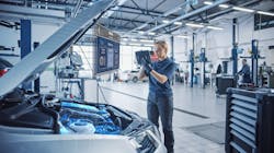 A technician uses a tablet computer with Augmented Reality diagnostics software. A technician uses a tablet computer with Augmented Reality diagnostics software.