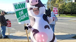 A picketer milking the moment outside Mack&apos;s facilities in Hagerstown, Maryland.