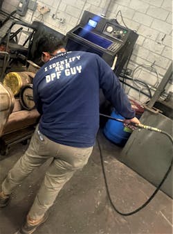 A technician manually air cleans a DPF using Enviromotive’s EvacuBlast equipment. A technician manually air cleans a DPF using Enviromotive’s EvacuBlast equipment.