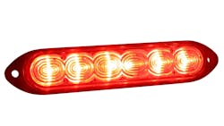 A Grote auxiliary strobe light, lit red A Grote auxiliary strobe light, lit red