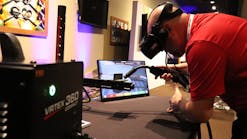 A Lincoln Electric employee tries the VRTEX 360 Compact, a more portable version of its virtual reality welding simulator.