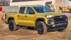 Nitro Yellow paint and edgy styling seem appropriate for a work site. The Colorado is about 10 percent smaller than a GMC Sierra (inset) or its Chevy Silverado twin, so it is easier to maneuver in everyday driving. Depending on equipment, a mid-size truck also costs $10,000 to $20,000 less. Nitro Yellow paint and edgy styling seem appropriate for a work site. The Colorado is about 10 percent smaller than a GMC Sierra (inset) or its Chevy Silverado twin, so it is easier to maneuver in everyday driving. Depending on equipment, a mid-size truck also costs $10,000 to $20,000 less.