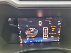 Trail Boss is at its best while off road, and the color screen (inset) shows the truck’s position relative to ground and transfer case setting, plus speed and engine condition gauges. Other information can be called up with a button on a steering wheel spoke. Trail Boss is at its best while off road, and the color screen (inset) shows the truck’s position relative to ground and transfer case setting, plus speed and engine condition gauges. Other information can be called up with a button on a steering wheel spoke.