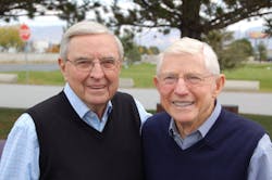Gene England (left) and his late brother Bill (right) joined their father Chester&apos;s trucking company upon returning home from serving in World War II.