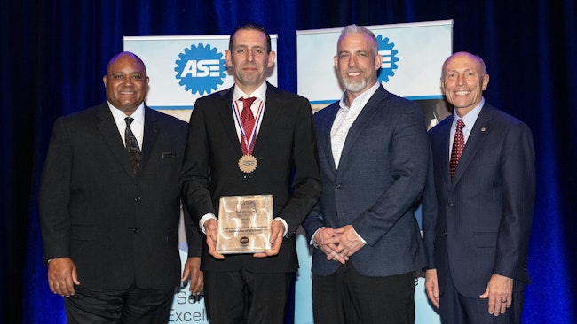 Joe Bologna, second from the right, receiving his ASE Automobile Technician of the Year Award