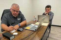 James Guzman (left) and his son Joe Gonzales (right) going over the financials of the shop they co-own, Guzman Automotive. James Guzman (left) and his son Joe Gonzales (right) going over the financials of the shop they co-own, Guzman Automotive.