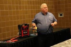 Vanair Director of Sales Jeff Steer with a Start•All Jump•Pack12/24V demonstrates a jump-starting clamp's usage. Vanair Director of Sales Jeff Steer with a Start•All Jump•Pack12/24V demonstrates a jump-starting clamp's usage.