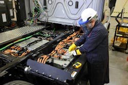 A technician works on a Freightliner eCascadia, Daimler Truck North America's heavy-duty battery-electric vehicle. The OEM is rolling out a BEV dealer certification program that it expects to be operating at 100 dealer locations by 2025. A technician works on a Freightliner eCascadia, Daimler Truck North America's heavy-duty battery-electric vehicle. The OEM is rolling out a BEV dealer certification program that it expects to be operating at 100 dealer locations by 2025.