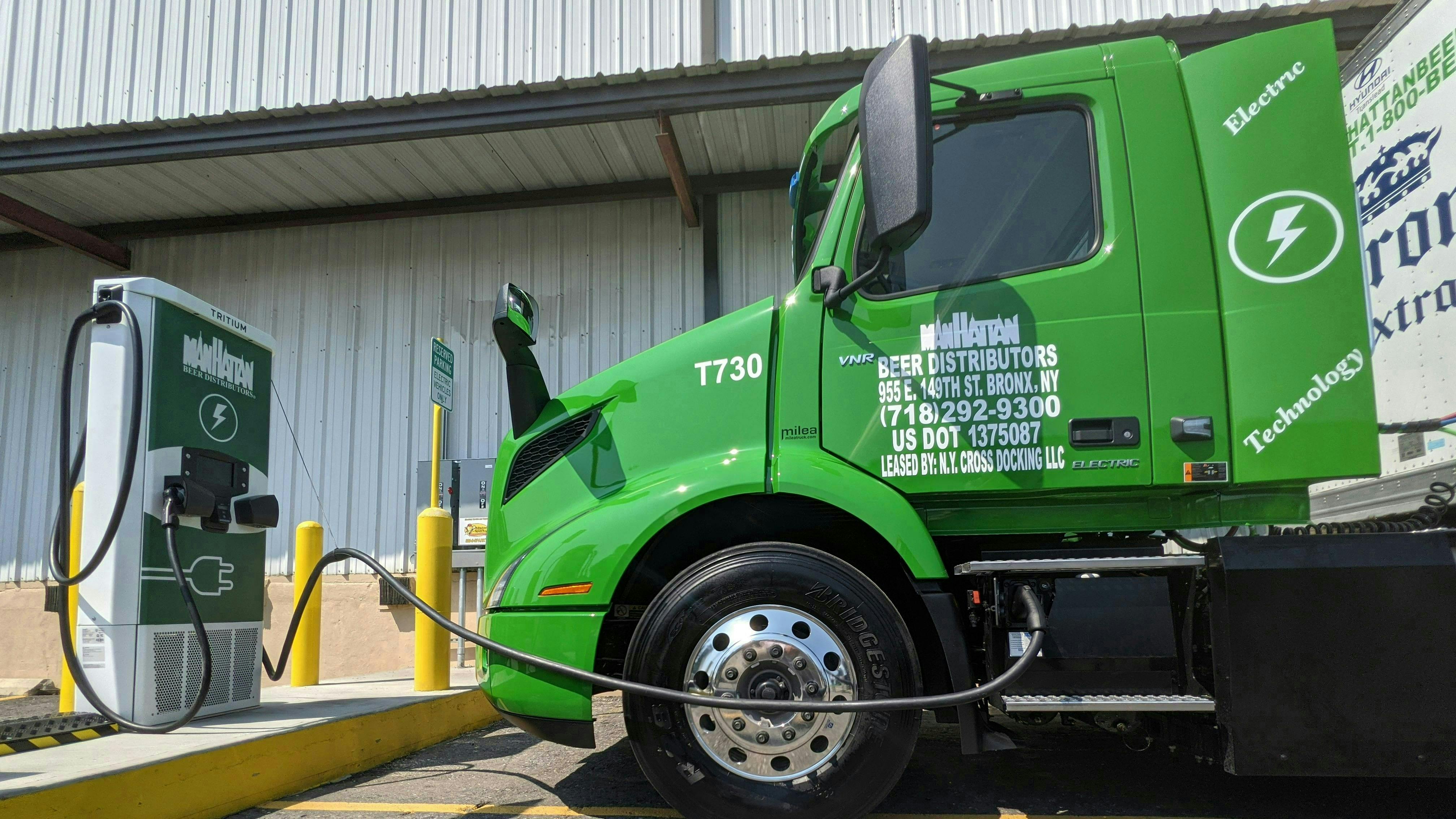 A heavy-duty Volvo VNR Electric truck charges in Hunts Point, New York, one of the most crowded trucking depot areas in the Northeast.