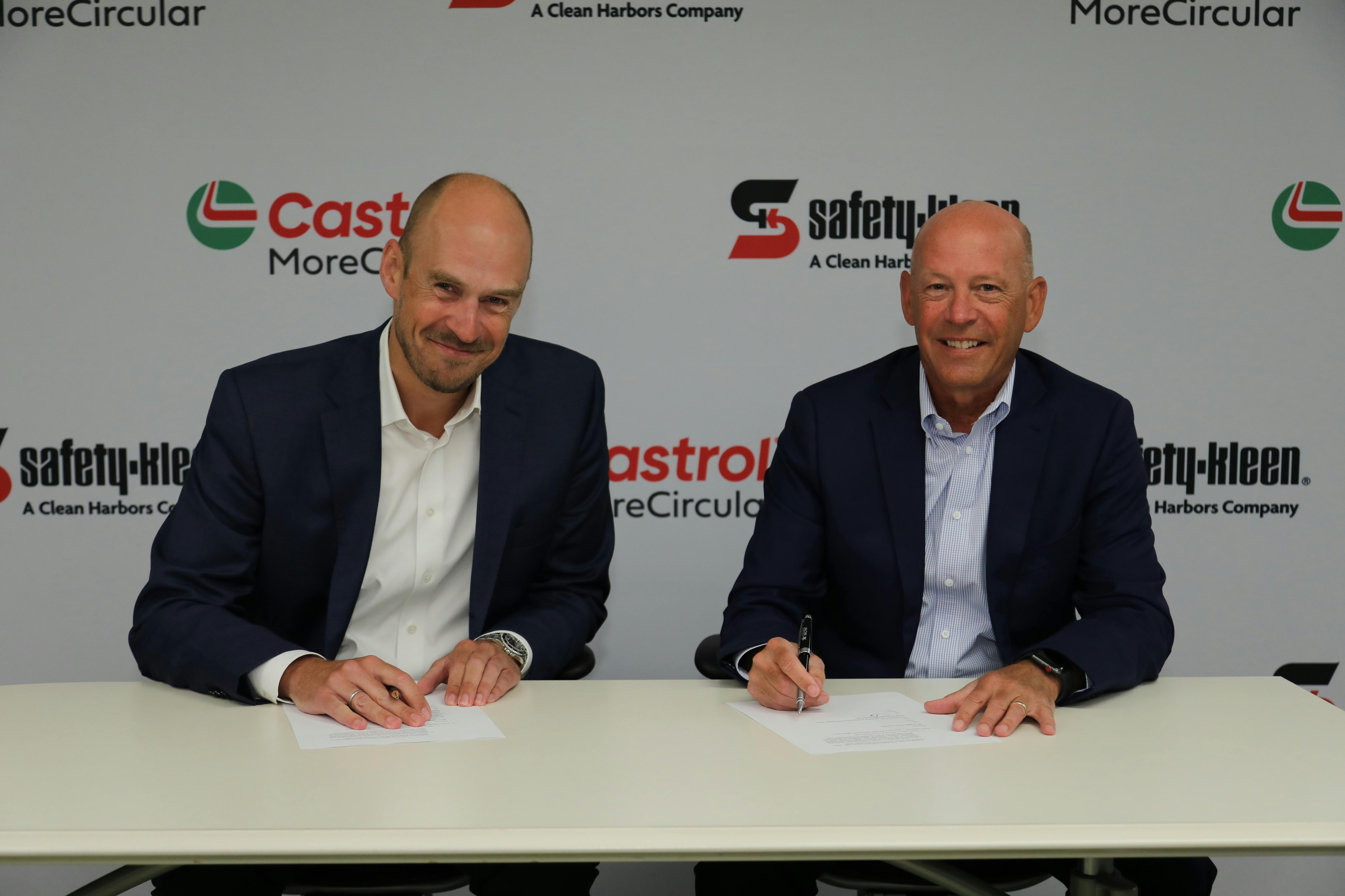 Andreas Osbar, CEO of Castrol Americas (left) and Brian Weber, President of Safety-Kleen Sustainability Solutions, a segment of Clean Harbors, sign the MoreCircular partnership agreement. This will enable Castol to collect and recycle used customer engine oil into new products.