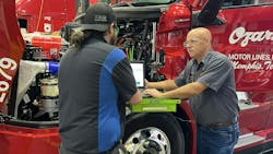 Dewey Bishop (right), technical trainer at Ozark Motor Lines, was one of inaugural winners of the Fleet Maintenance Overachiever Awards in 2023.