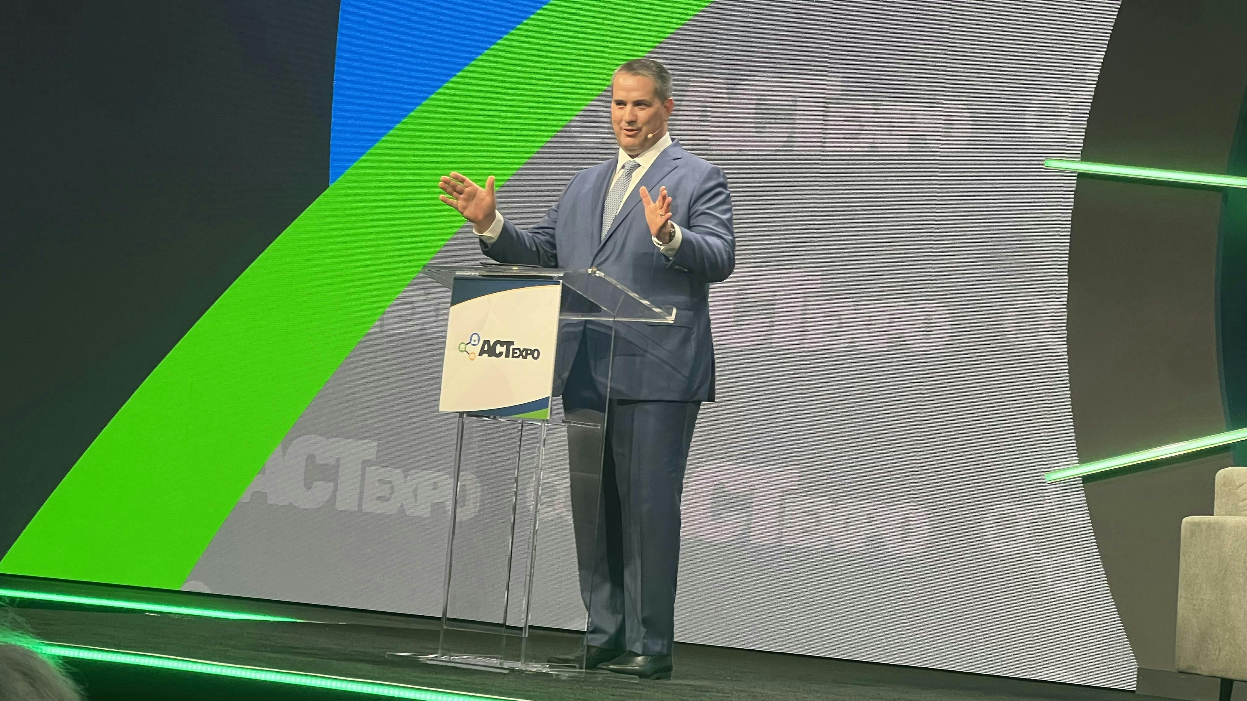 Eric Neandross, GNA president, addresses the crowd at ACT Expo in Las Vegas.