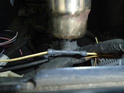 Figure 3 — This image shows how heat is applied first to the center of the shrink tube, working towards the outer edges. Figure 3 — This image shows how heat is applied first to the center of the shrink tube, working towards the outer edges.