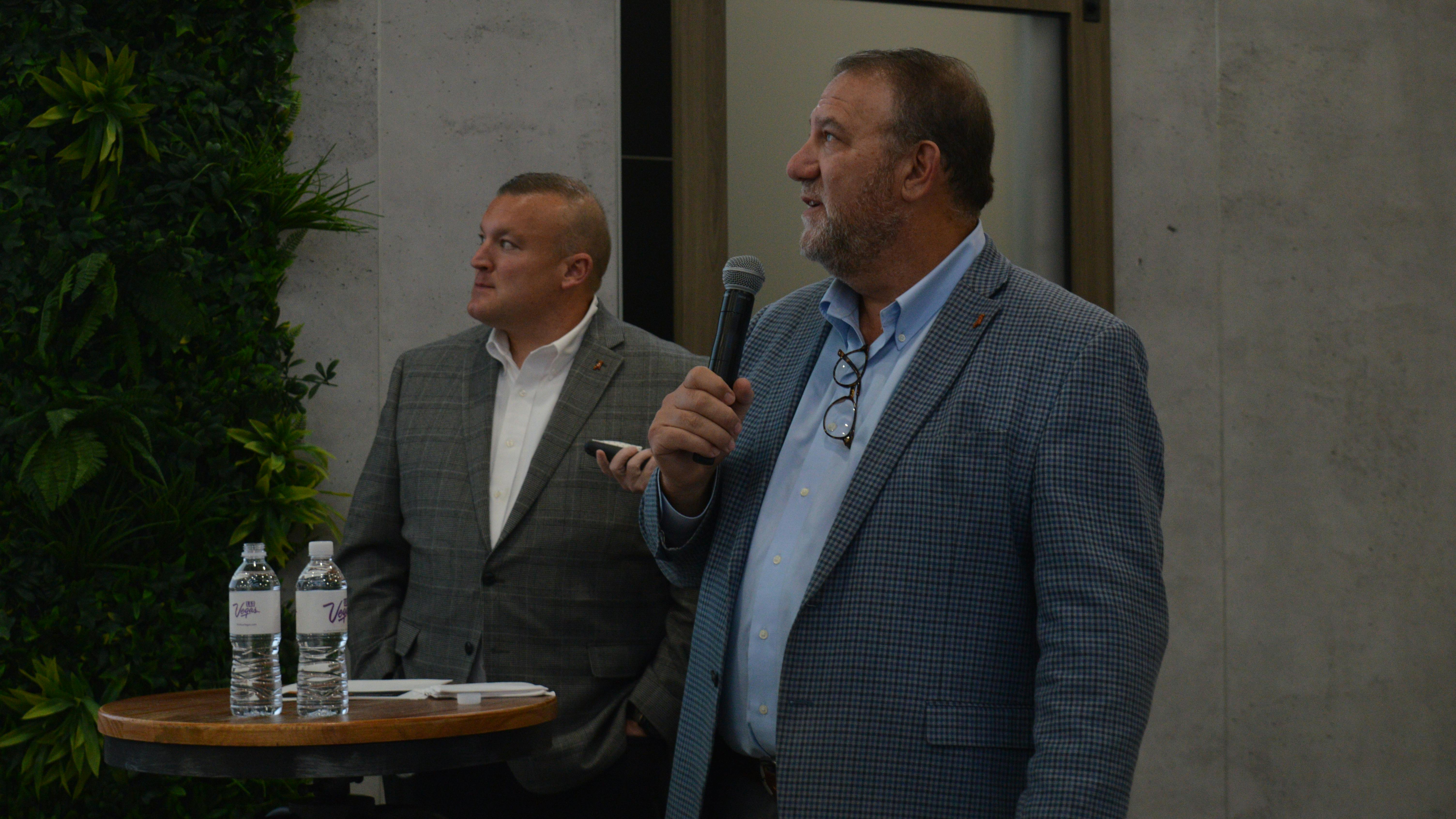 Jonathan Randall, president, and Tyler Ohlmansiek, director of e-mobility sales for Mack, at ACT Expo in Las Vegas.