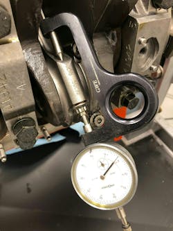 Once the stretch gauge has been zeroed to a specific bolt, the bolt is installed and torqued to spec. The gauge is then placed back onto the bolt to see how much bolt stretch has occurred. In this case, this bolt has stretched just a tick over 0.004-inch. Max stretch for this particular bolt is 0.005-inch. Once the stretch gauge has been zeroed to a specific bolt, the bolt is installed and torqued to spec. The gauge is then placed back onto the bolt to see how much bolt stretch has occurred. In this case, this bolt has stretched just a tick over 0.004-inch. Max stretch for this particular bolt is 0.005-inch.