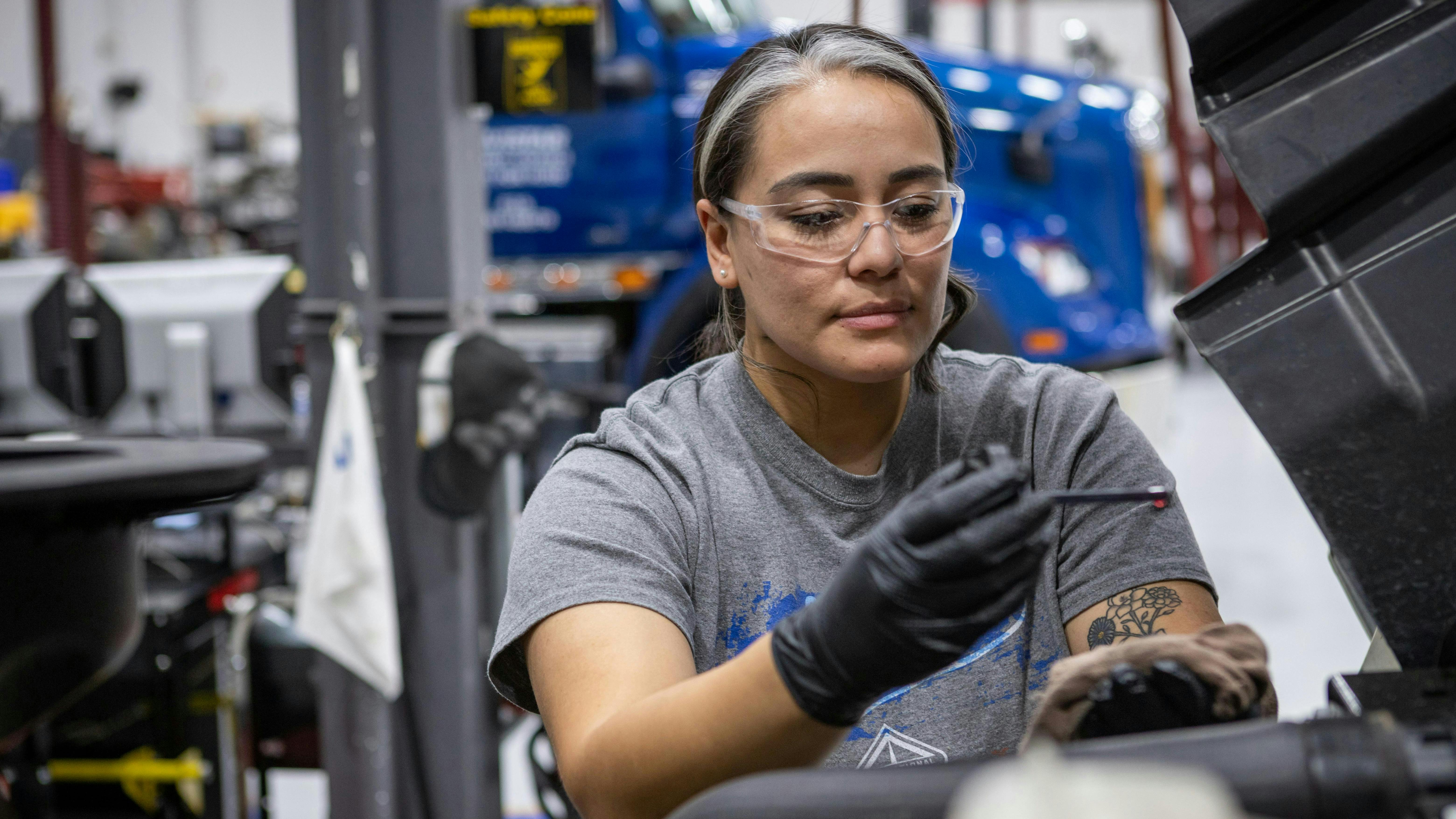 female_mechanic_checking_oil_2682_6240x4160