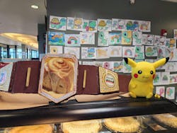 Johnson's Corner's cinnamon rolls are stacked on several shelves throughout the convenience store and can be ordered in the restaurant. Johnson's Corner's cinnamon rolls are stacked on several shelves throughout the convenience store and can be ordered in the restaurant.