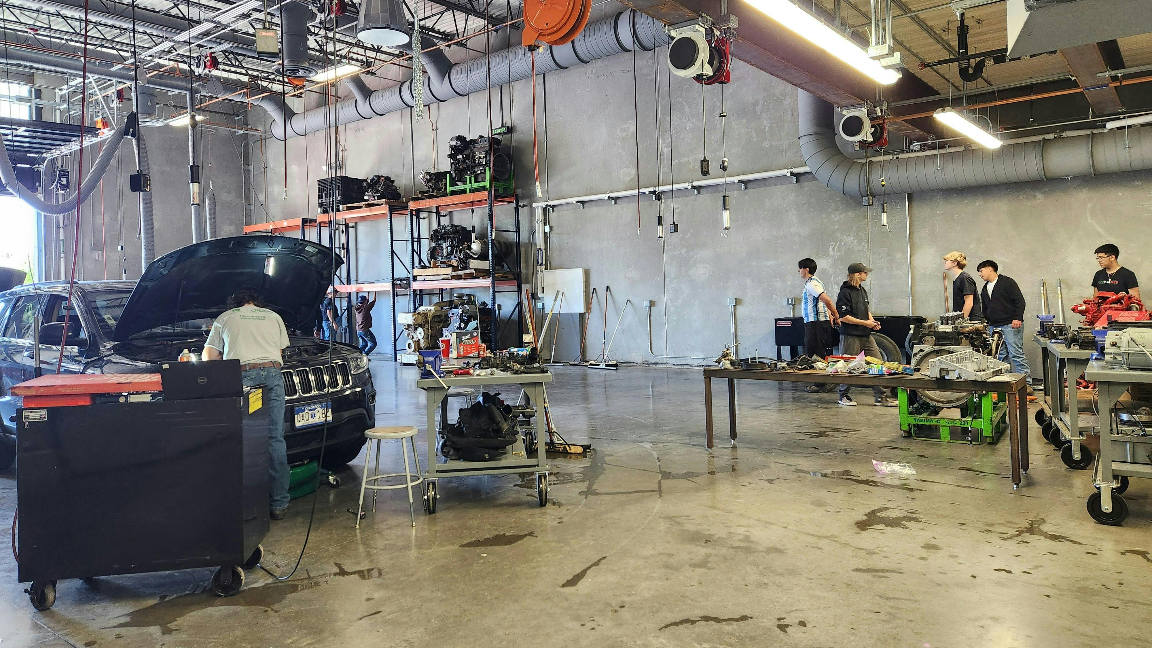 FutureForward at Washington Square's diesel classes clean up the shop near the end of the school year.