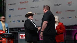 Randy Patterson, chairman of the TMC SuperTech competition, congratulates FedEx Freight technician and TMC SuperTech 2024 Grand Champion Doug Nickles as he walks onstage. Randy Patterson, chairman of the TMC SuperTech competition, congratulates FedEx Freight technician and TMC SuperTech 2024 Grand Champion Doug Nickles as he walks onstage.