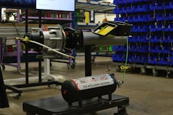 An up-close look at the MTIS puts the simplicity of the system on full display. The green hose connects the trailer's air tank to the control box, which regulates and sends the air through the hollow axle to be distributed to the tires. An up-close look at the MTIS puts the simplicity of the system on full display. The green hose connects the trailer's air tank to the control box, which regulates and sends the air through the hollow axle to be distributed to the tires.