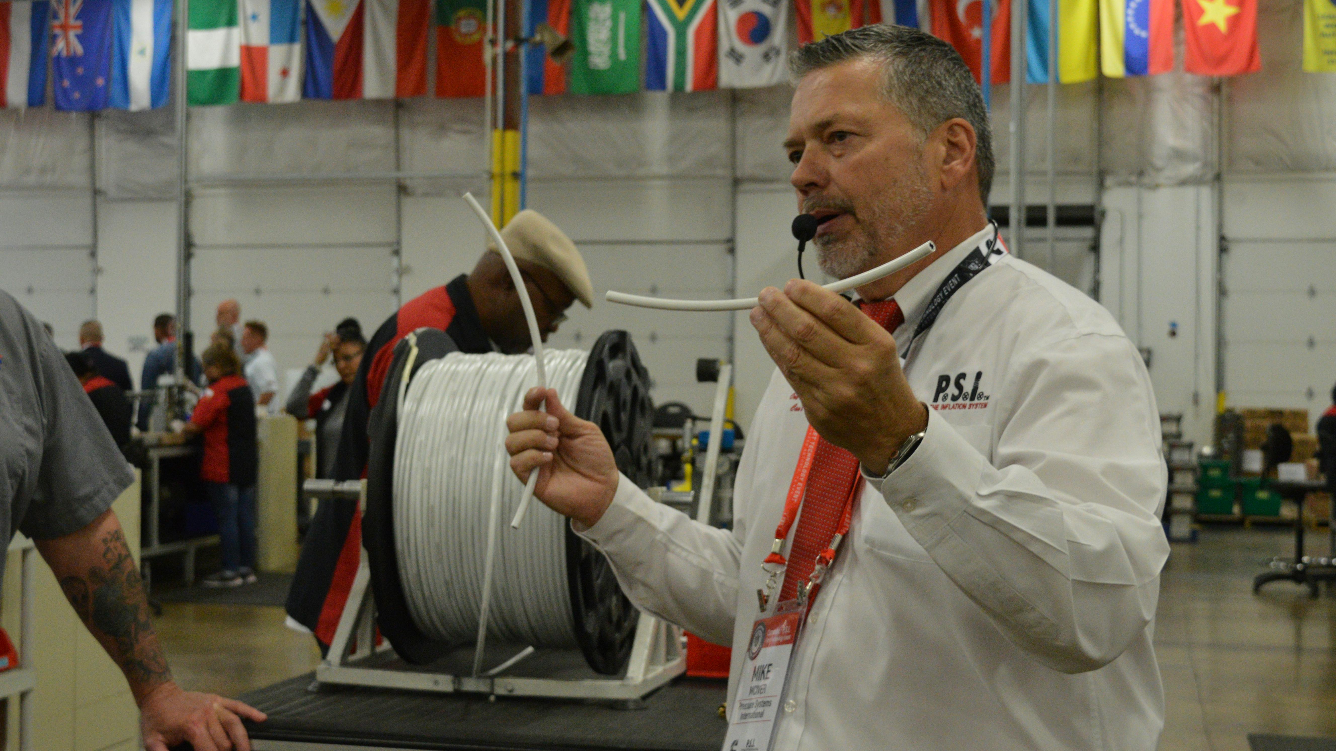 Mike Mciver, VP of manufacturing for PSI, discusses air hose quality in the company's San Antonio plant.