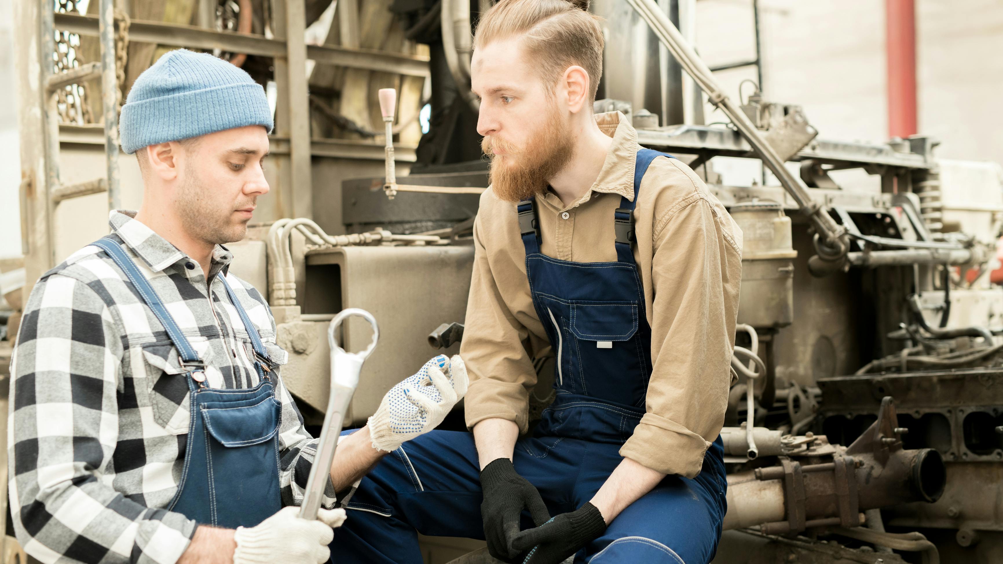 vehicle-techs-talking-dreamstime_117599017