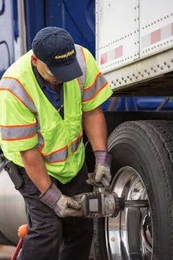 Goodyear Fleet HQ technician providing emergency roadside assistance for customer's fleet vehicle. Goodyear Fleet HQ technician providing emergency roadside assistance for customer's fleet vehicle.