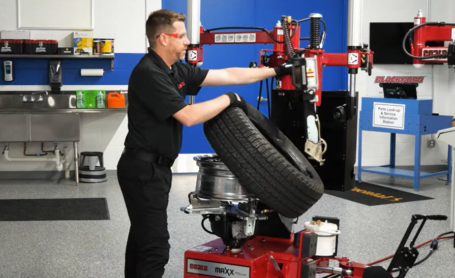 Kyle Harris, senior product manager for tire changers and balancers at The Coats Company, demonstrates how to safely operate a Coats Maxx 90.