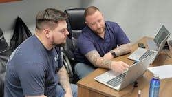 Matt Brown, regional maintenance manager, at right, goes over a review with Justin Coon, at left. Matt Brown, regional maintenance manager, at right, goes over a review with Justin Coon, at left.