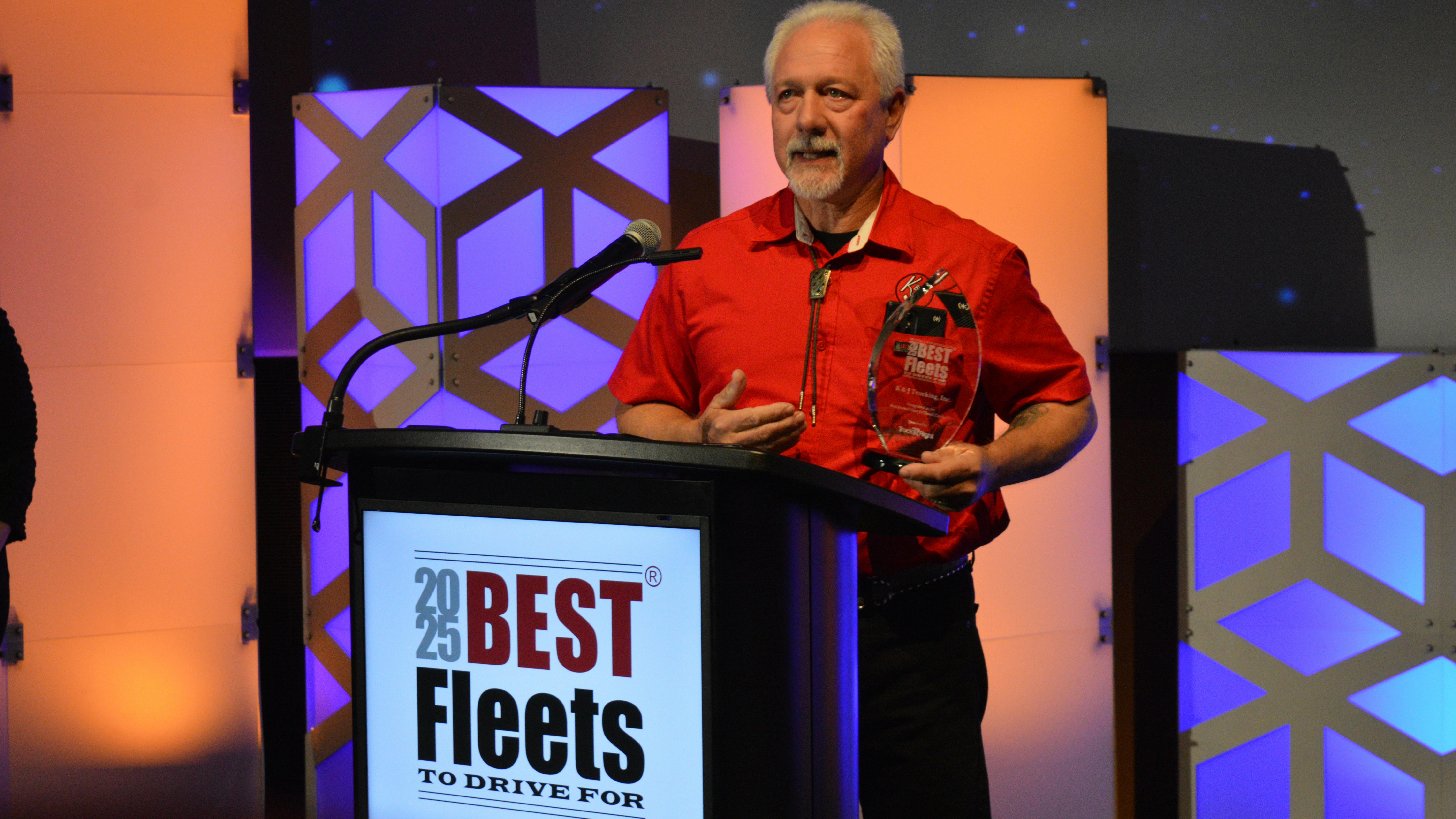 Theron Thompson, owner-operator with K&J Trucking, addresses the crowd after accepting the award for Best Overall Fleet in the small carrier category.