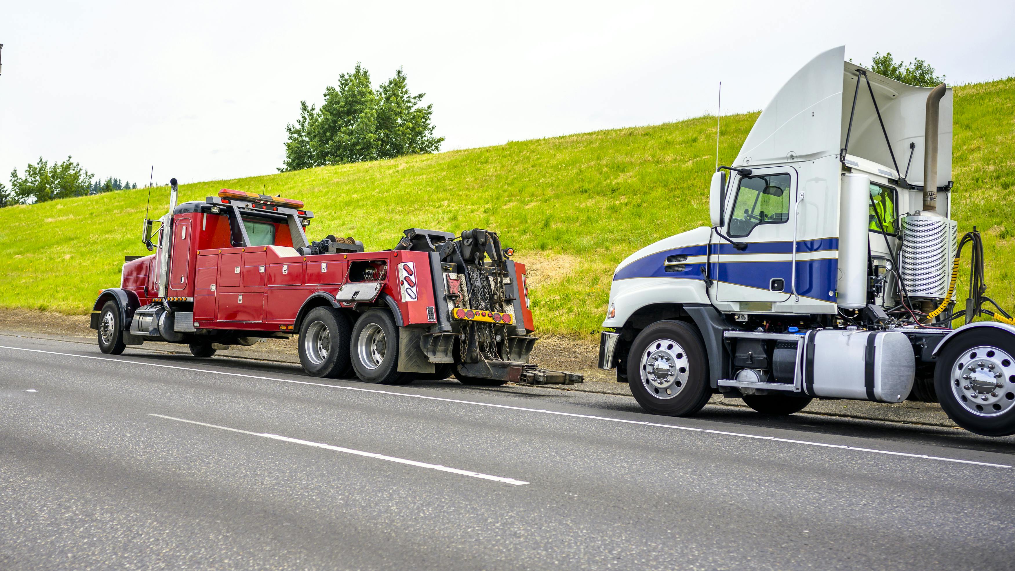 semi being towed-dreamstime_xl_189866128