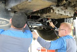 City of Loveland Emergency Vehicle Technicians working on (under) a fire engine. City of Loveland Emergency Vehicle Technicians working on (under) a fire engine.