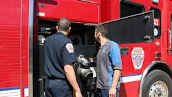 Loveland Fire Rescue Authority Engineer and City of Loveland Emergency Vehicle Technician troubleshooting a pump issue on a fire engine. Loveland Fire Rescue Authority Engineer and City of Loveland Emergency Vehicle Technician troubleshooting a pump issue on a fire engine.