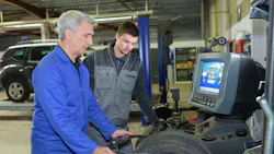 Dreamstime mechanic teaching young technicain Dreamstime mechanic teaching young technicain