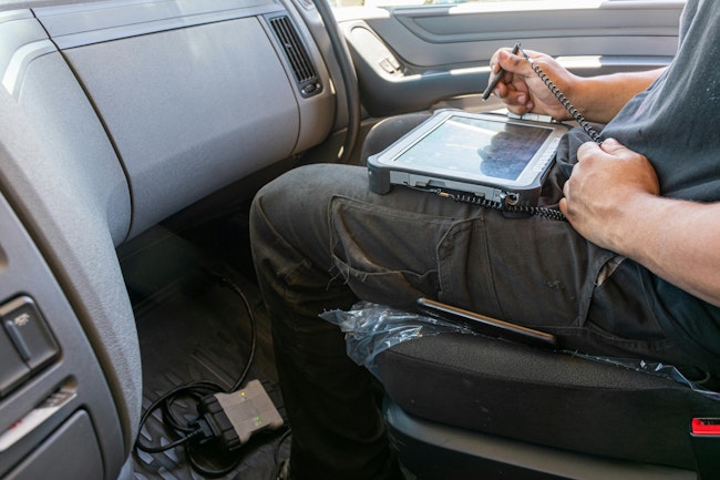 Dreamstime truck mechanic with tablet