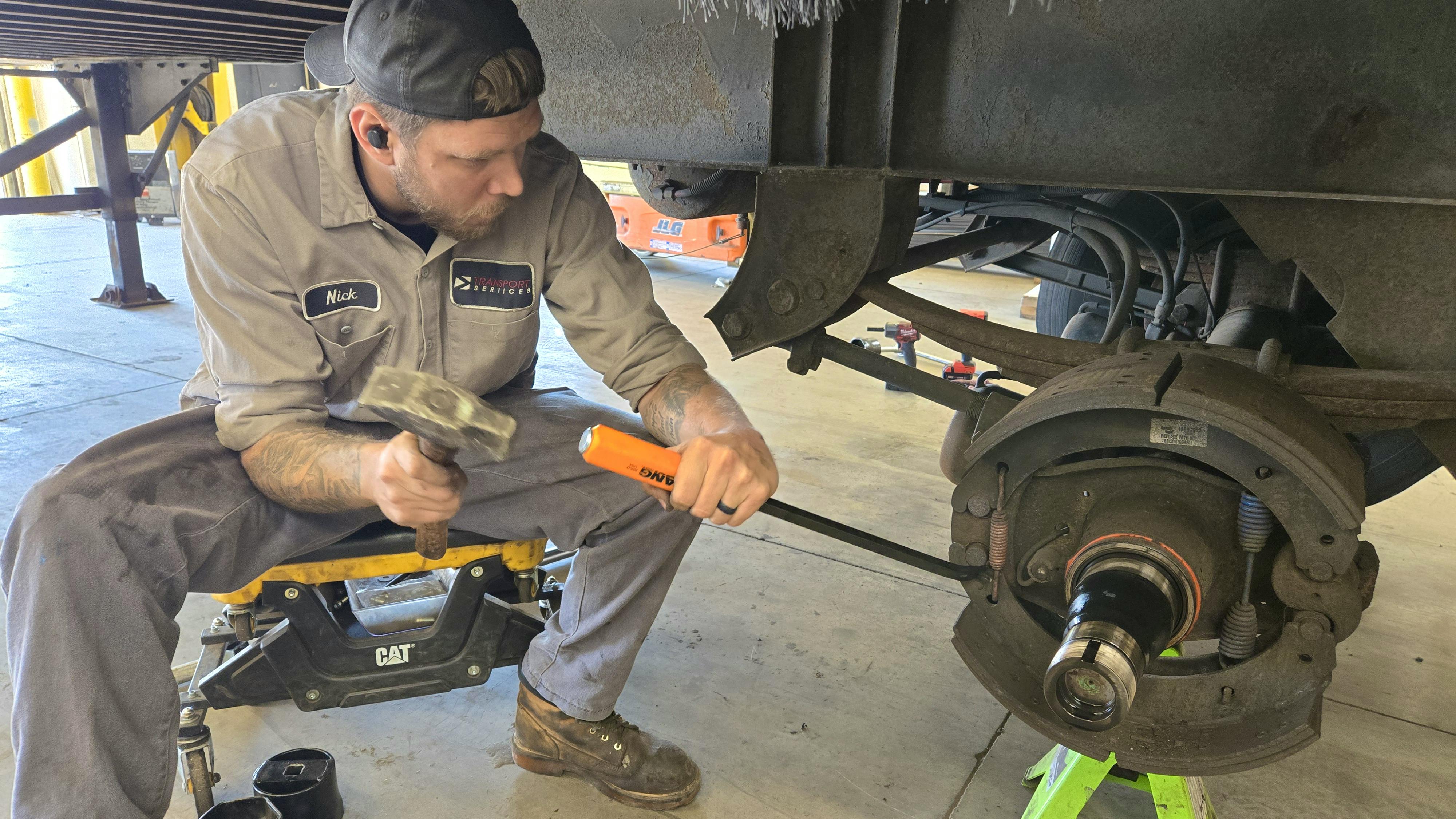 Transport Services tech using Lang Brake Spring tool