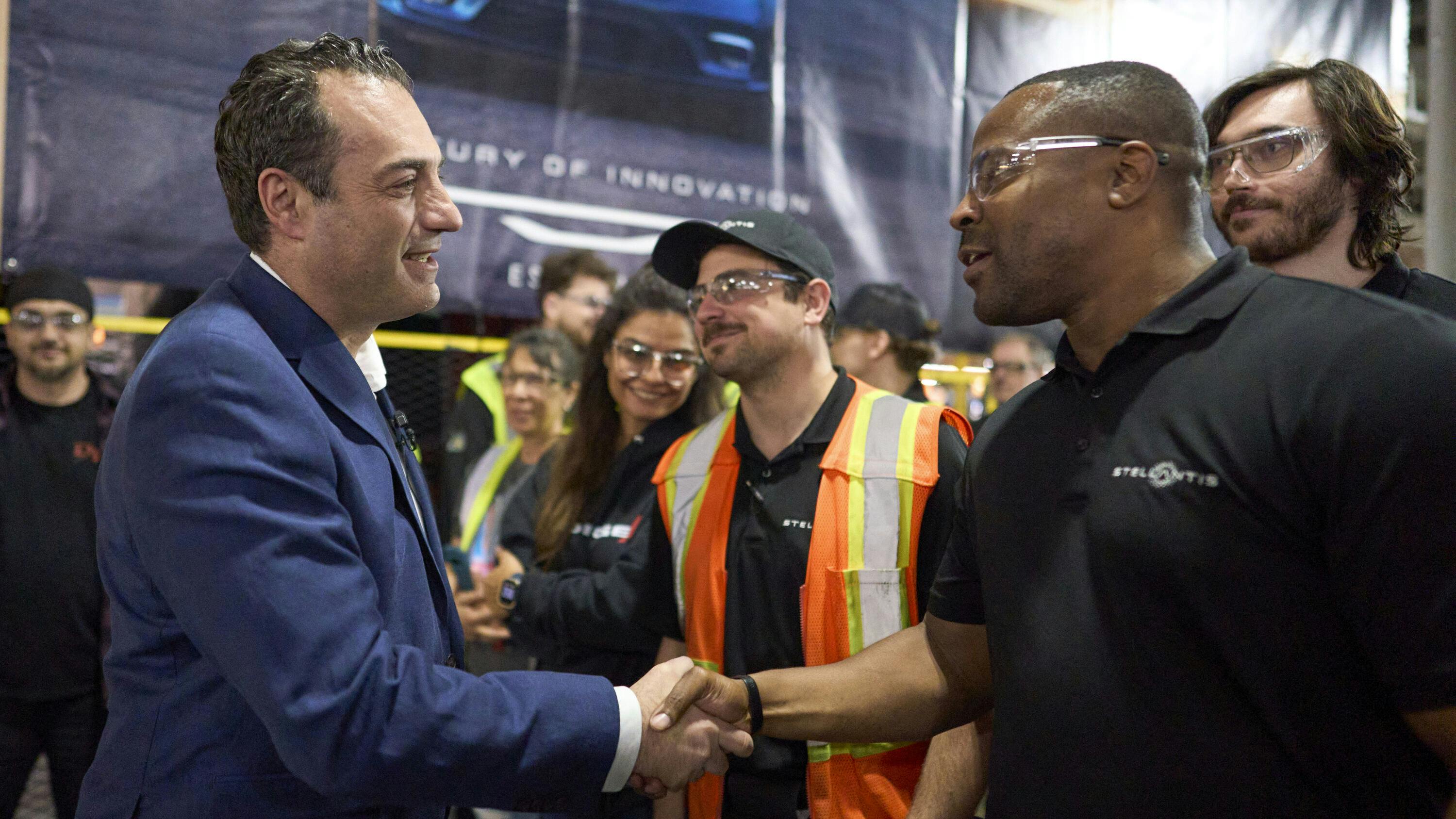 Stellantis Antonio Filosa greets worker at Chrysler