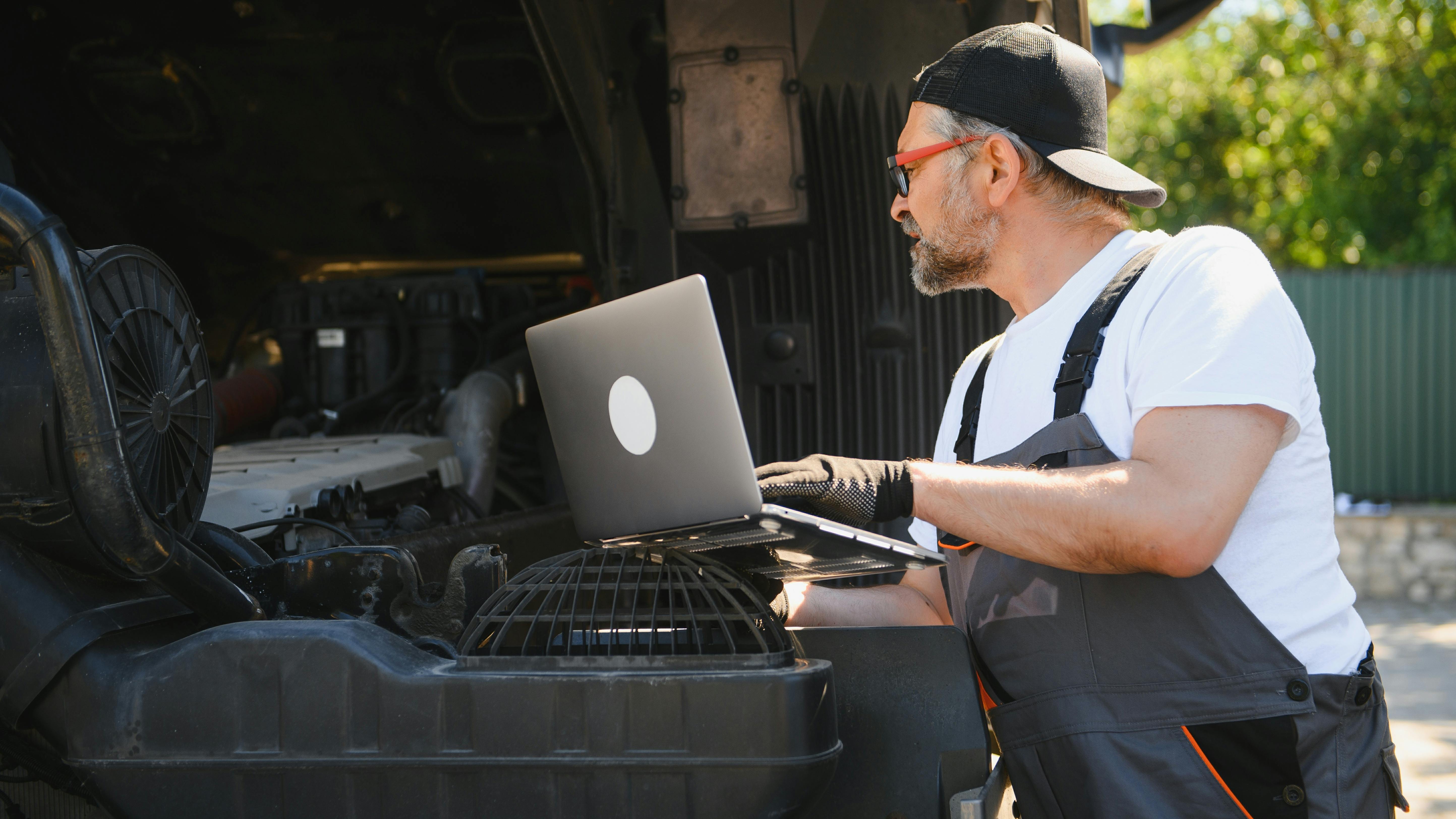 technician with laptop technology