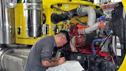 Technician recording diagnostic data Technician recording diagnostic data