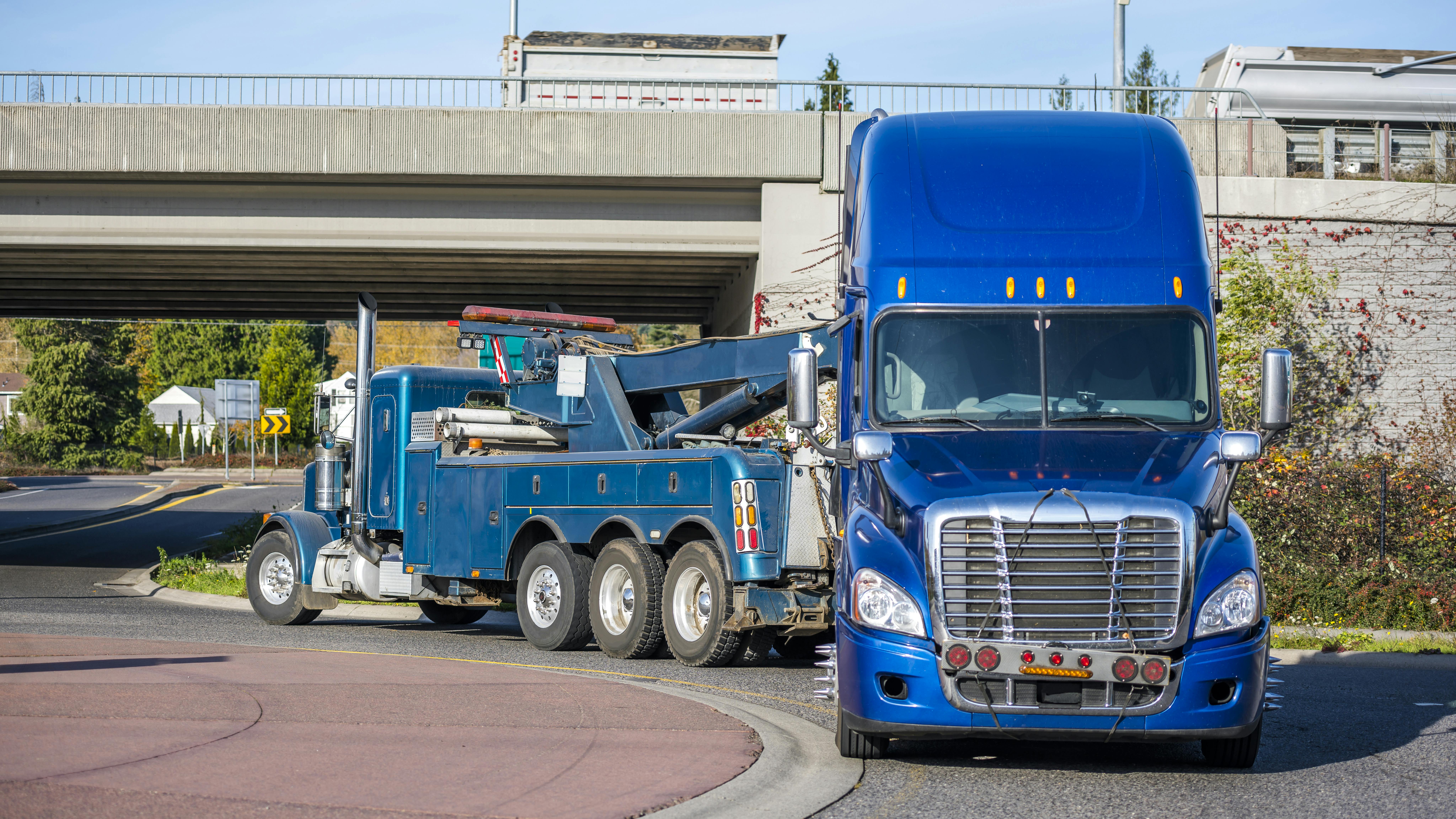Semi truck being towed