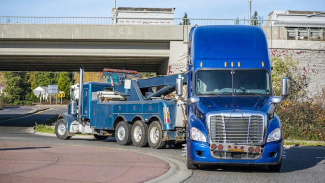 Semi truck being towed