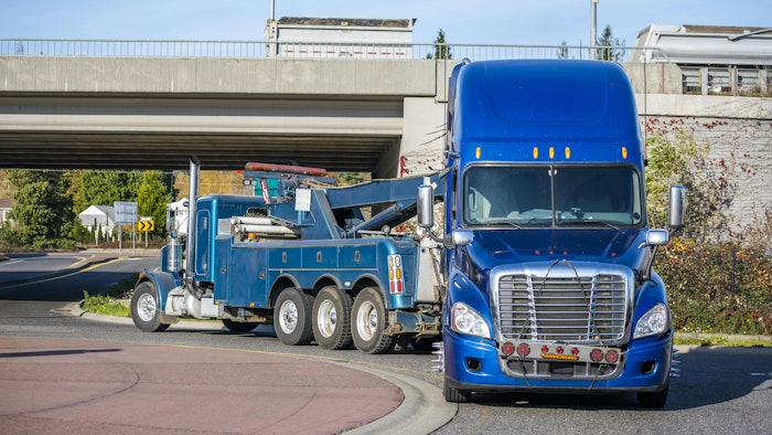 Semi truck being towed