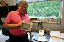Chris Hammond holds a photo from World War II Chris Hammond holds a photo from World War II