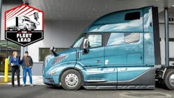 Service advisor posing with driver at truck Service advisor posing with driver at truck