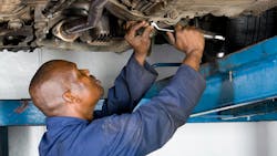 Technician working on a truck Dreamstime Technician working on a truck Dreamstime